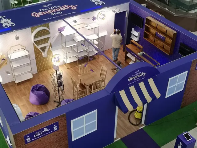 Cadbury’s Little Generosity Shop seen from above: a purple shopfront with a striped awning and a furnished interior
